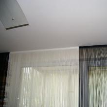 Hidden curtains in a suspended ceiling